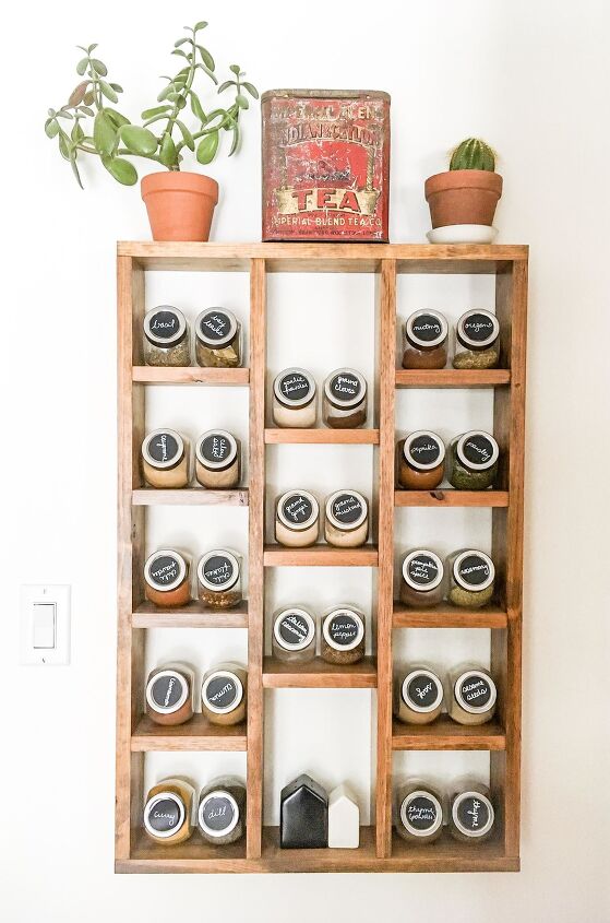 s 25 must try storage tricks that ll save your sanity, Organize your spices with labeled glass canisters