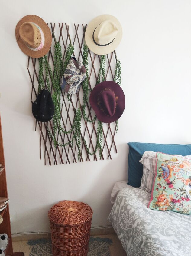s 25 must try storage tricks that ll save your sanity, Hang your hats among the plants on a bamboo lattice trellis