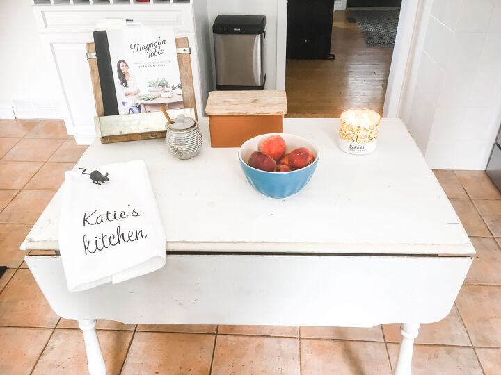 16 tricks that ll save you money on a full kitchen reno, Turn an antique table into an island