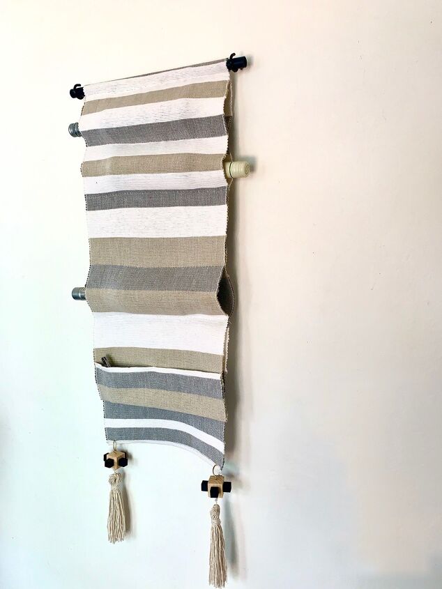 s 18 things you never thought to hang on your walls why you should, Transform a table runner into a fabric hanging wine rack
