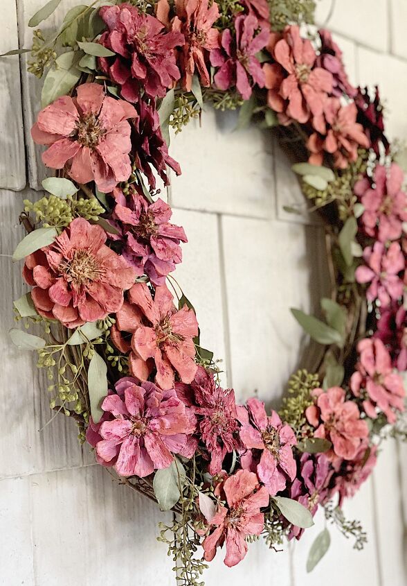 15 beautiful ways to use collected pine cones this season, Decorate your door with a floral wreath made from cut pine cones