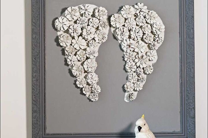 15 beautiful ways to use collected pine cones this season, Turn white dipped pine cones into dreamy angel wing wall art