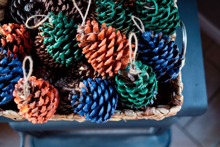 15 beautiful ways to use collected pine cones this season, Dip pine cones in colored beeswax to make beautiful fire starters