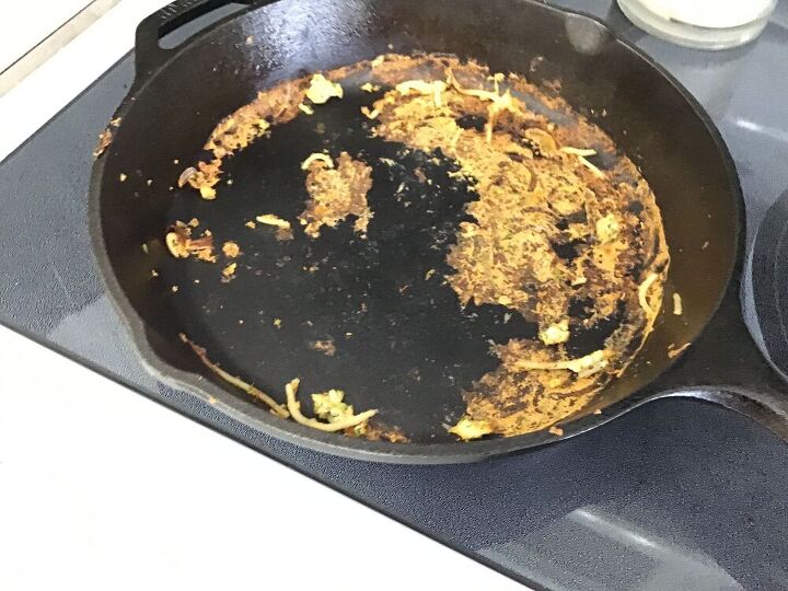 q how do you clean a cast iron skillet with burnt pasta eggs