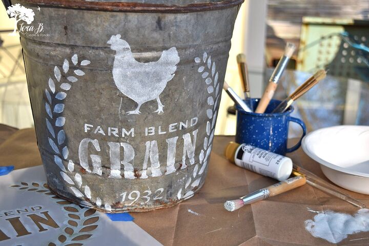 16 creative hacks to turn baskets and buckets into designer decor, Turn an old metal pail into a farm style stenciled gift bucket