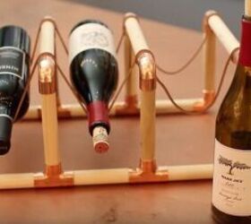 s 20 near brilliant ways to beautify your home using dowels, Go industrial with a DIY wine rack from wooden dowels copper elbows and leather lace