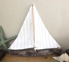 s 20 near brilliant ways to beautify your home using dowels, Construct a whimsical driftwood sailboat with dowels twine and fabric