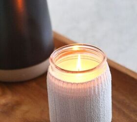 28 genius ways to reuse your old clothing, Cover up ugly candle labels with an cozy sock