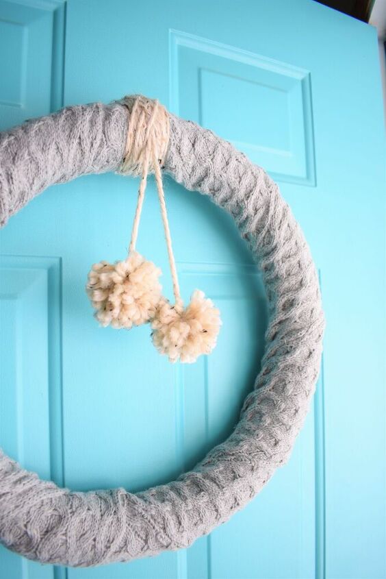 20 ways to warm up your home without touching the thermostat, Feel at home with a snuggly pompom sweater wreath