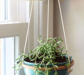 s 19 surprising ways to turn plain embroidery hoops into home decor, Craft a clean and modern hanging succulent planter for your home