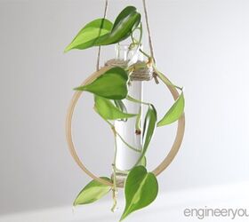 s 19 surprising ways to turn plain embroidery hoops into home decor, Go modern with a hanging test tube plant propagation station