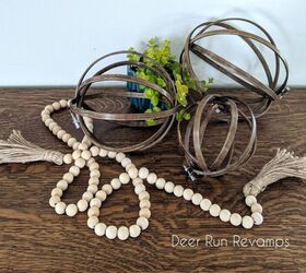 s 19 surprising ways to turn plain embroidery hoops into home decor, DIY these rustic wooden orbs from embroidery hoops