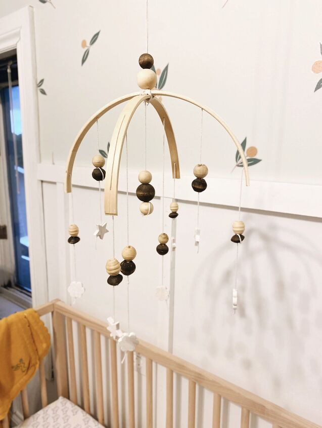 s 19 surprising ways to turn plain embroidery hoops into home decor, Show your baby some love with a homemade boho crib mobile