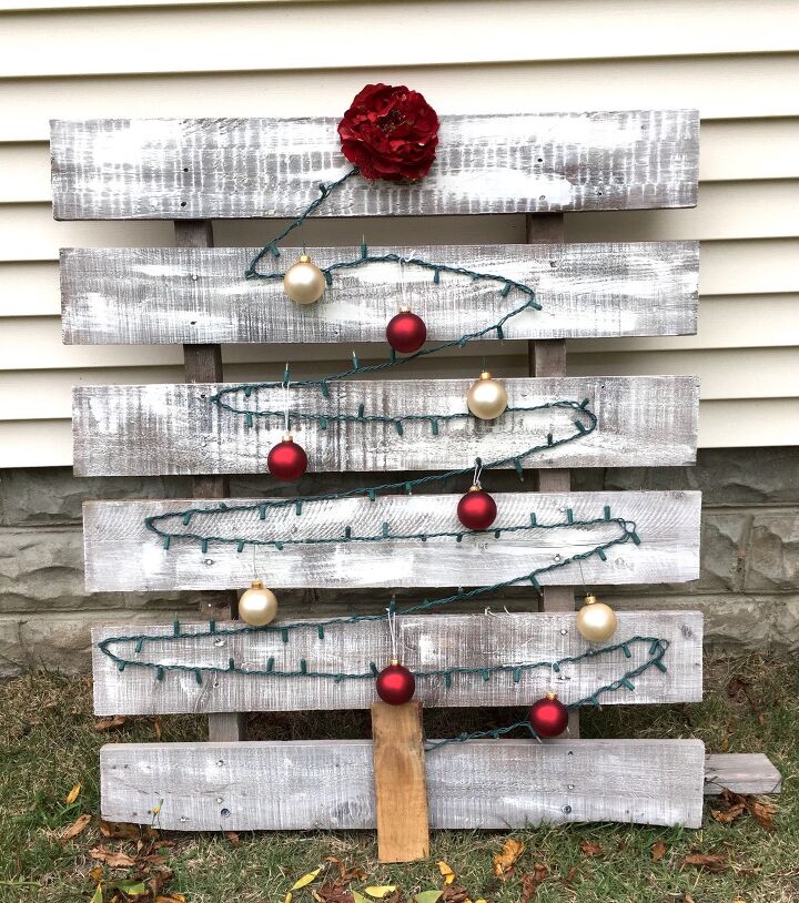 s replace your halloween porch decor with these 20 ideas, Get festive with a glowing Christmas tree on a rustic pallet