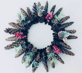 s replace your halloween porch decor with these 20 ideas, Deck your door with a stunning pinecone winter wreath