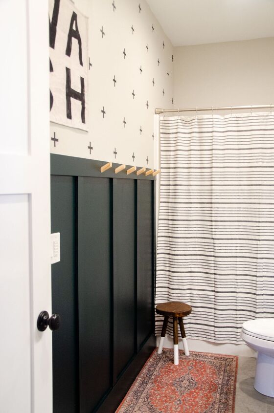 20 of our favorite board and batten wall transformations, Give a small bathroom a makeover with a bold board and batten wall