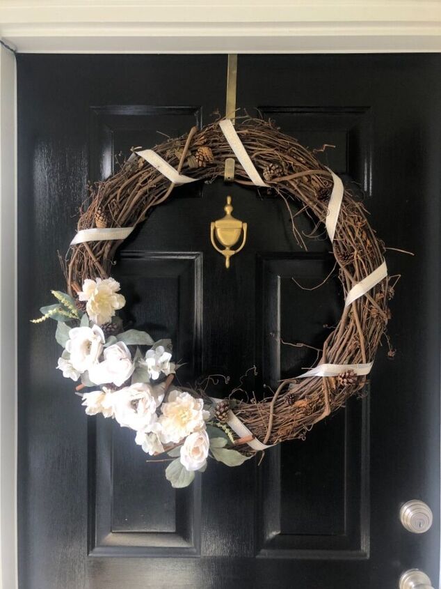 15 winter wreaths we re so ready to hang on our doors, Keep it classy with a ribbon and twine floral wreath