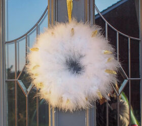 15 winter wreaths we re so ready to hang on our doors, Make your door glitter with a chic feather boa wreath