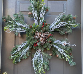 15 winter wreaths we re so ready to hang on our doors, DIY a beautiful snowflake wreath from evergreen boughs