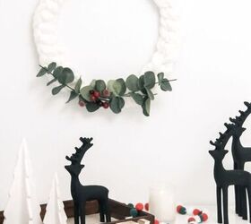 15 winter wreaths we re so ready to hang on our doors, Embrace winter with a chunky arm knit yarn wreath