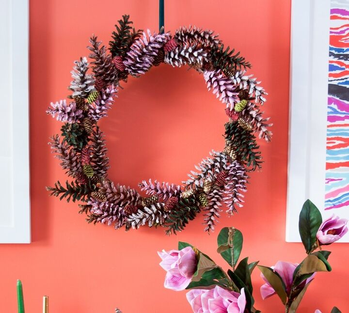 15 winter wreaths we re so ready to hang on our doors, Add color and texture to your home with a painted pinecone wreath