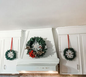 15 winter wreaths we re so ready to hang on our doors, Repurpose wooden clothespins into beautiful snowflake wreaths