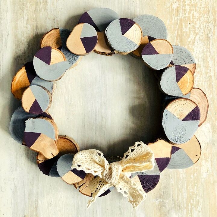 15 winter wreaths we re so ready to hang on our doors, Make a stylish wreath from wood slices