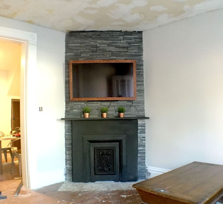 s 20 fireplace makeovers that will get your home in shape for the cold, Go bold with a charcoal grey fireplace facelift