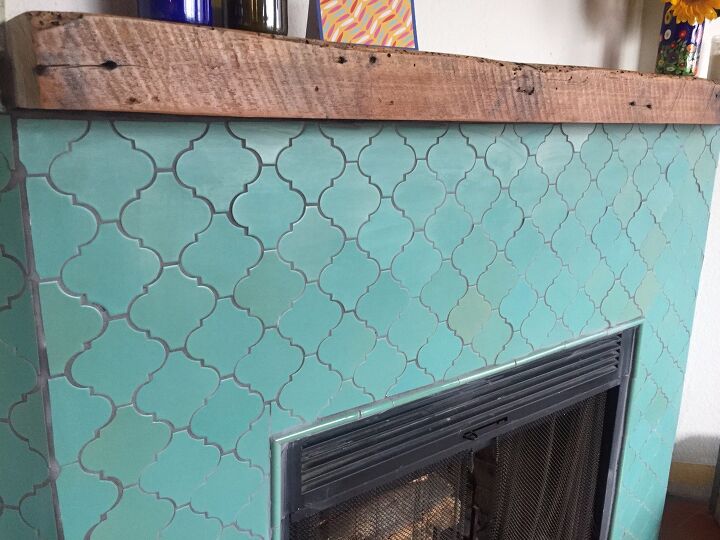 s 20 fireplace makeovers that will get your home in shape for the cold, Give your fireplace a dash of color with a bright tile fa ade