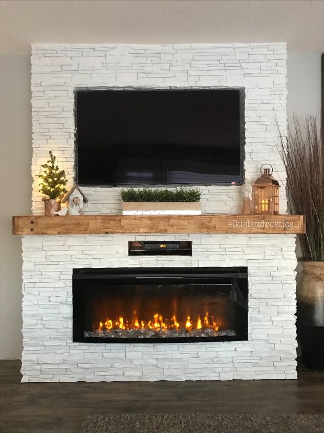 s 20 fireplace makeovers that will get your home in shape for the cold, Transform a boring flat wall into a faux stone fireplace