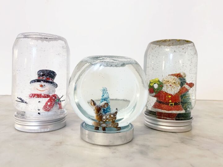 s 11 christmas decor ideas made from dollar store finds, DIY the cutest snowglobes from jars