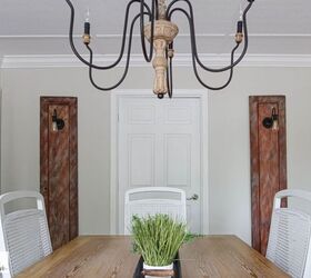 s 13 surprising ways people are using old doors in their homes, Attach classy sconce lights to vintage doors for a touch of rustic elegance