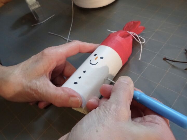 s 20 insanely cute snowmen that ll make it feel like winter, Upcycle toilet paper rolls into delightful snowman Christmas crackers