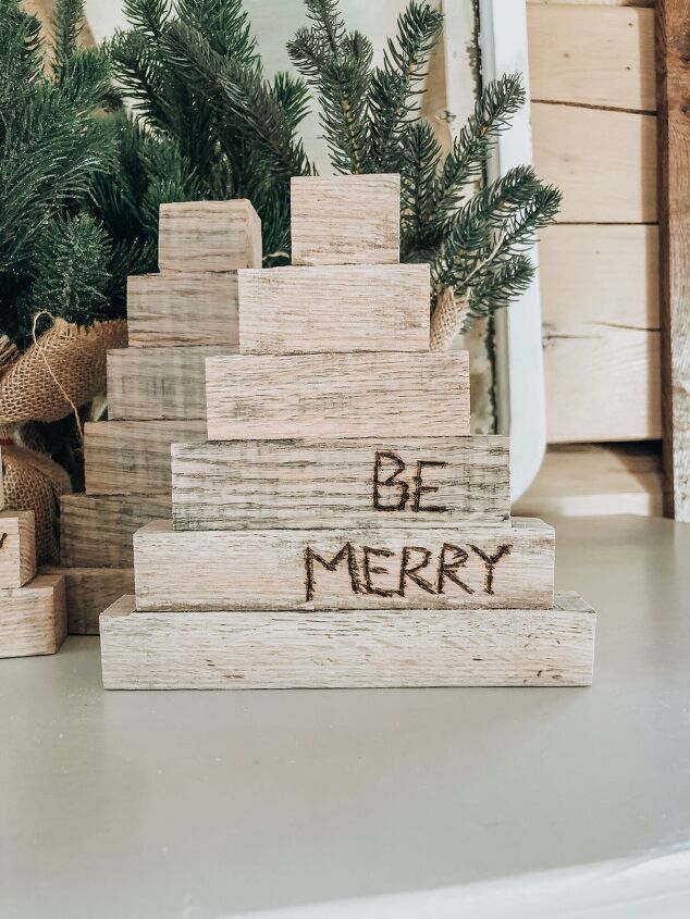 s 16 of our all time favorite christmas upcycles, Go rustic with a decorative Christmas tree made from wood scraps
