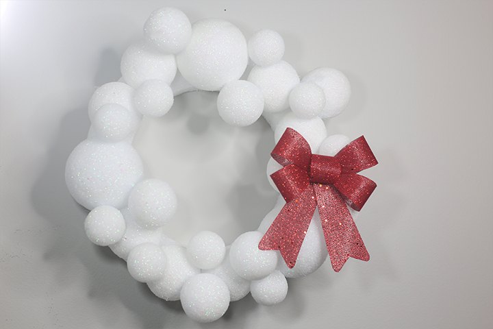 s 15 dollar store christmas ideas to copy this season, Celebrate winter with a beautiful snowball wreath made from foam balls