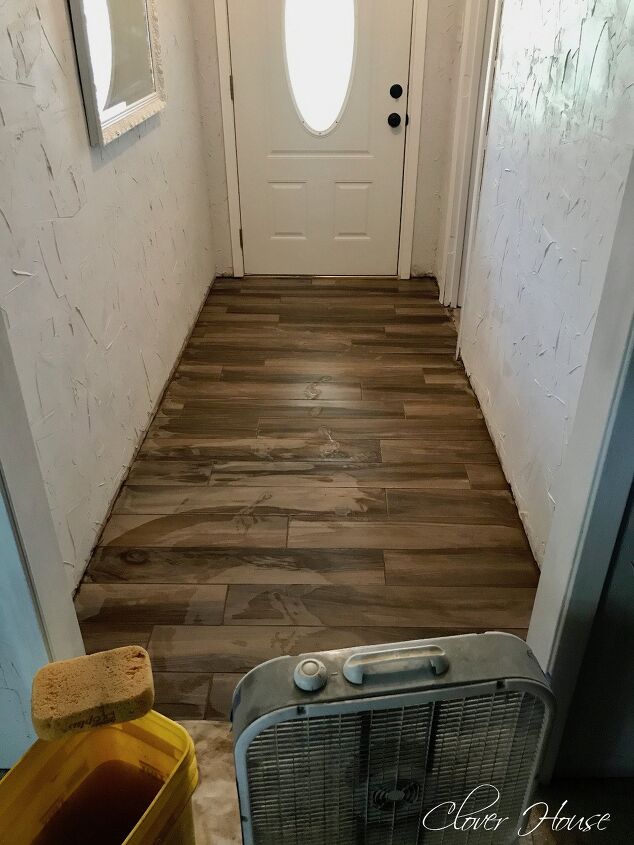 s 30 floor makeovers that will transform any room from the bottom up, Replace an outdated floor with faux wood porcelain tiles