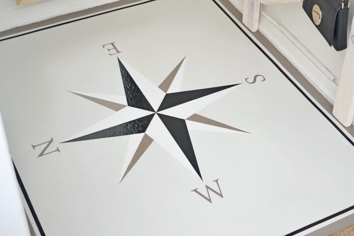 s 30 floor makeovers that will transform any room from the bottom up, Transform your entryway with a striking compass rose on a ram board