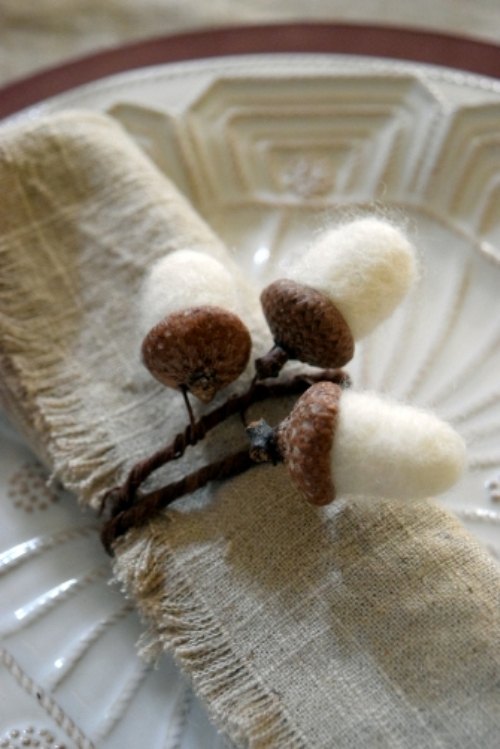 s 20 easy ways to get a gorgeous thanksgiving table, Go rustic this Thanksgiving with dreamy needle felted acorn napkin rings