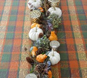 s 20 easy ways to get a gorgeous thanksgiving table, Transform a pine cone Christmas garland into a Thanksgiving table runner