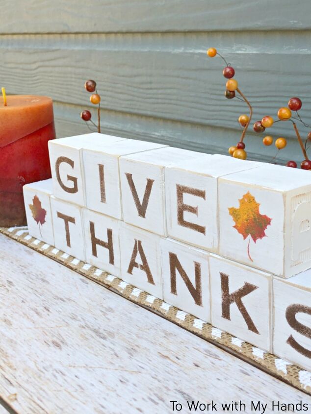 s 20 easy ways to get a gorgeous thanksgiving table, Repurpose toy blocks into reversible wood block signs for the holidays