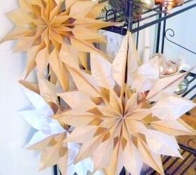 s 30 magical ways to make your home feel more merry and bright, Repurpose brown paper bags into gorgeous 3D snowflakes