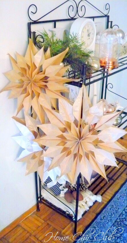 s 30 magical ways to make your home feel more merry and bright, Repurpose brown paper bags into gorgeous 3D snowflakes