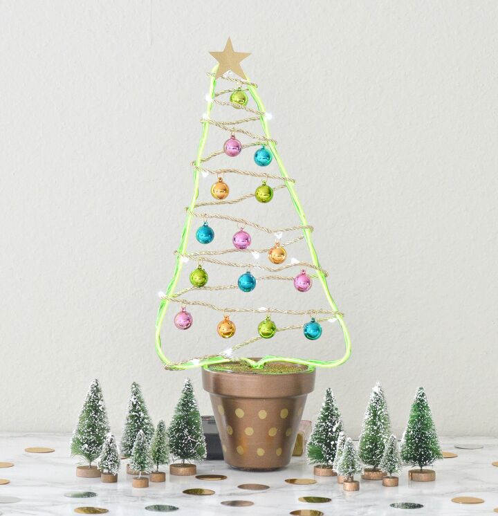 s 30 magical ways to make your home feel more merry and bright, Brighten your home with an adorable flower pot Christmas tree