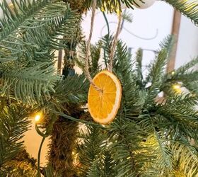 s 25 new christmas ornament ideas that we re totally obsessed with, String together a simple orange slice garland for your tree