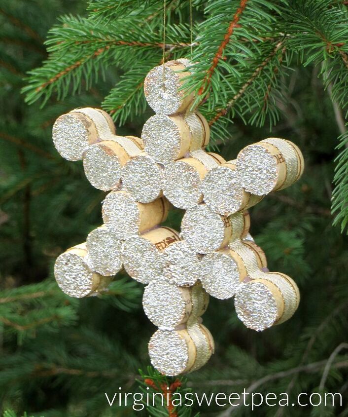 s 25 new christmas ornament ideas that we re totally obsessed with, Repurpose wine corks into unique snowflake ornaments