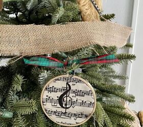 s 25 new christmas ornament ideas that we re totally obsessed with, Celebrate the gift of song with sheet music ornaments