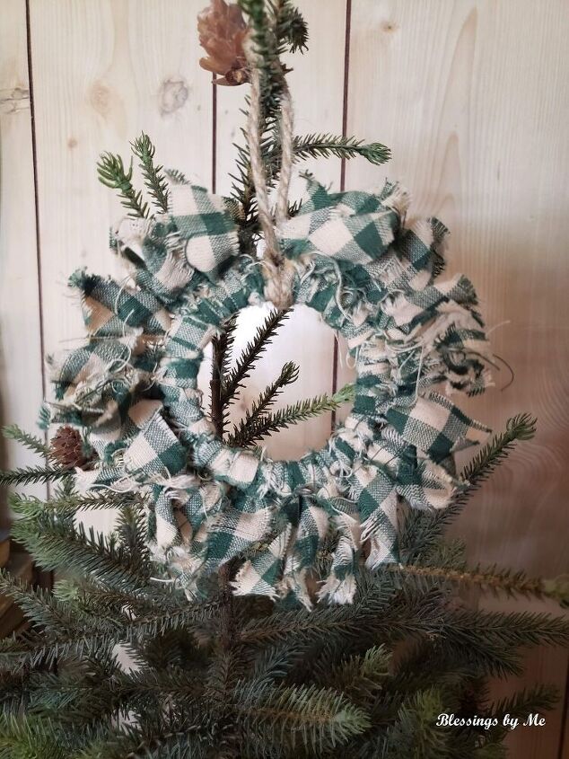 s 25 new christmas ornament ideas that we re totally obsessed with, Repurpose mason jar lid rings into primitive wreath ornaments