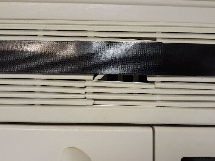 q how can i replace or fix this over stove microwave vent cover brkn