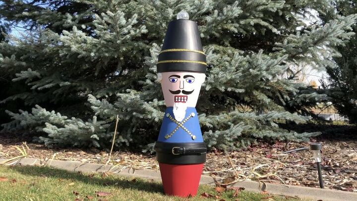 s 10 gorgeous holiday topiaries to try this season, Flower Pot Nutcracker Soldier