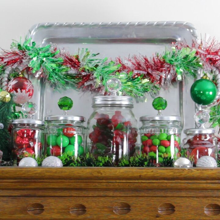 s 19 gorgeous ways to style your mantel for christmas, Upcycle empty glass jars into festive mantel decor